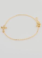 Pulsera religiosa chapada en oro y cruz con pedrería