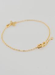 Pulsera religiosa chapada en oro y cruz con pedrería