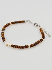 Pulsera con cruz y piedras color marrón
